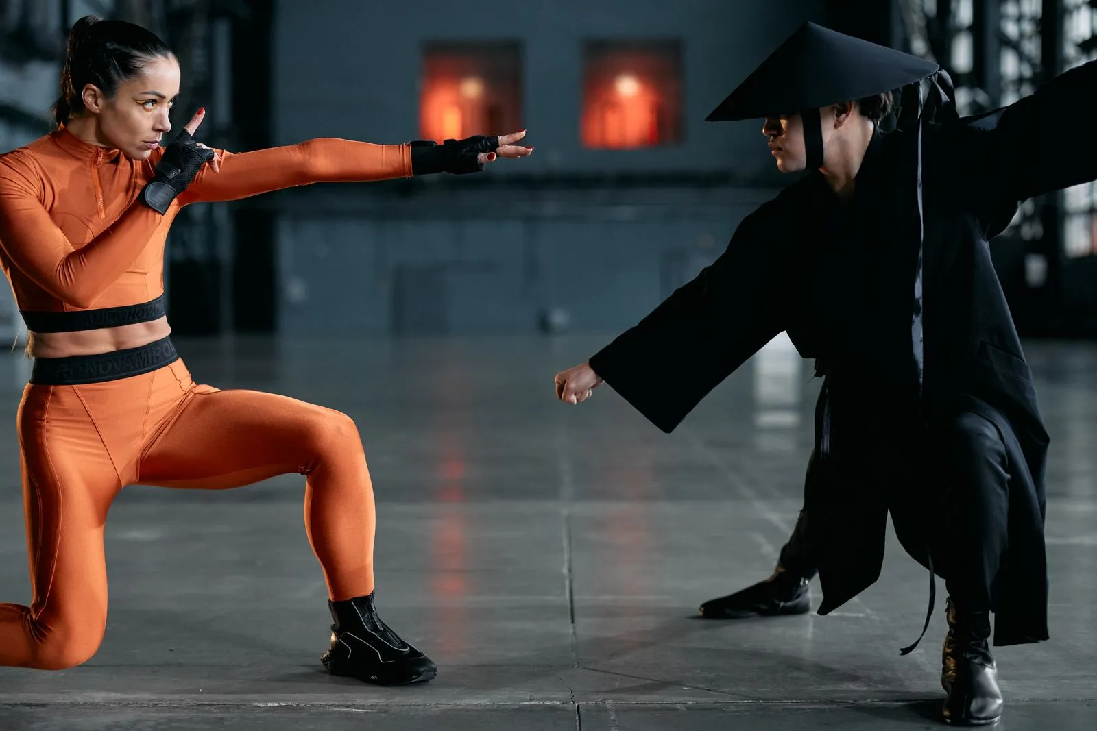 Two martial artists in a fierce pose, showcasing modern cosplay inspired by classic fighting games.